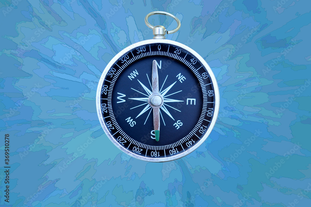 Wall mural round compass on abstract background as symbol of tourism with compass, travel with compass and outd