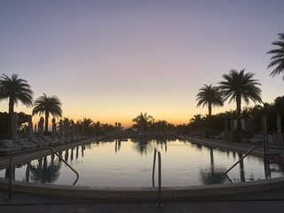 Fototapeta premium Reflective pool under a dusky sunset