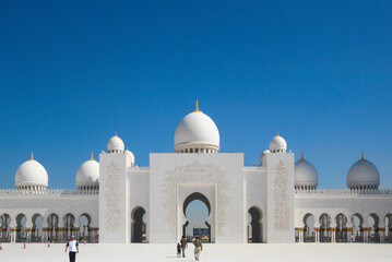 Mosque Sheikh Zayed bin Sultan Al Nahyan ABU DHABI. The gate and white domes against the blue sky