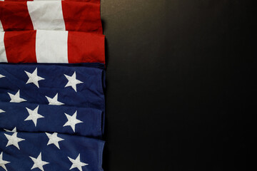 Close up of waving national usa american flag on black background.