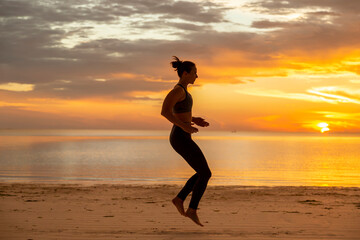 Fototapeta na wymiar Woman working out on the beach