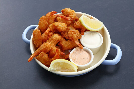 Portion Of Breaded Shrimps With Dipping Sauces