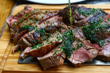 Portion of grilled beef chateaubriand with herbs