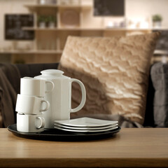 Desk of free space and blurred background of sofa 