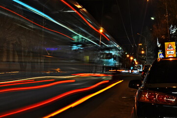 Fototapeta na wymiar Bus traffic at night. Shutter speed shooting