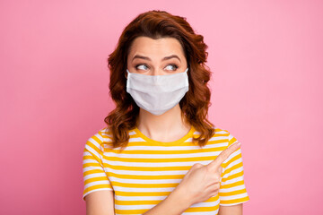 Close-up portrait of her she nice attractive wavy-haired healthy girl wearing safety mask demonstrating copy space info mers cov therapy symptom syndrome disease isolated pink pastel color background