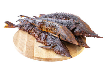 smoked sterlet or sturgeon fish. smoked dilicates sterlet sturgeon fish on a wooden board. isolated...