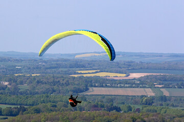 Paraglider flying at Combe Gibbet, England	