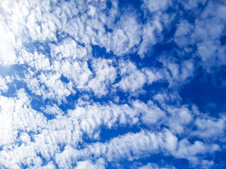 clouds are arranged in a long fashion on blue sky background