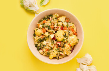 Summer salad with colored on a yellow background.