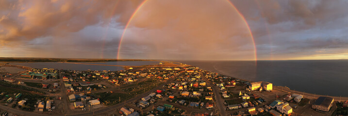 Rain falls as sun shines in the middle of the night at Kotzebue Alaska creating a beautiful...