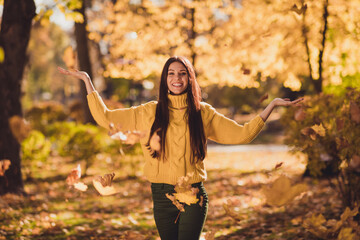 Photo of positive cheerful girl have fall park woodland relax outdoors catch throw orange maple...