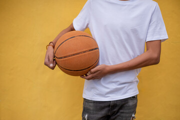 Cropped shot of young person holding basketball