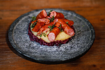 gourmet sausage with mashed potatoes and cabbage