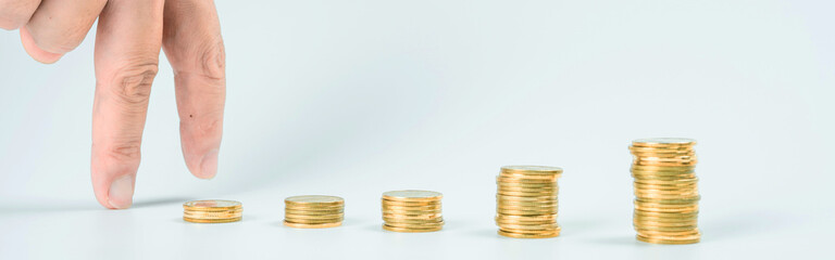 web banner business and finance investment and saving activity with gold coin arrange on white...