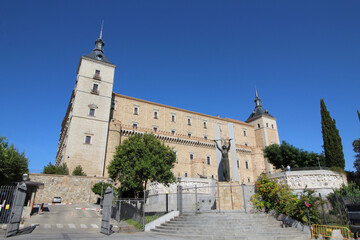 Fototapeta na wymiar Medieval Alcazar Palace in Toledo, Spain with Statue.