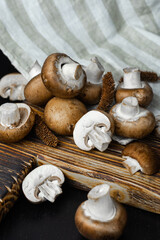 Royal fresh mushrooms on a wooden background. Black background. Close up