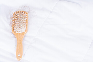 Hair fall problem, closeup comb with problem hair. Healthcare medical or daily life concept.