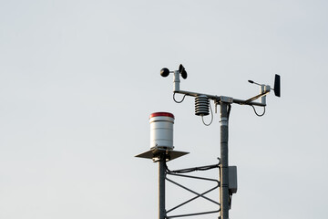 Anemometer on sky background, wind speed indicator equipment technology