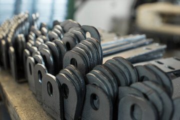 Products bent on a bending machine, close-up. Factory made metal parts.