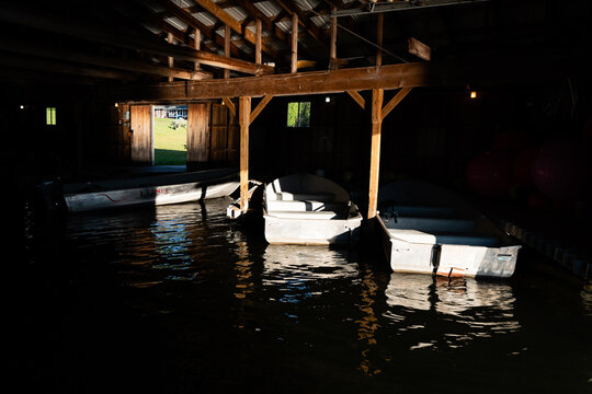 Row boats inside boathouse