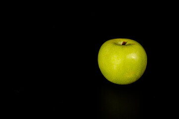 green apple on black