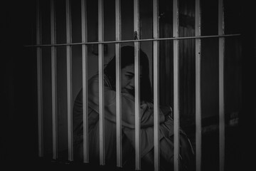 Hands of women desperate to catch the iron prison,prisoner concept,thailand people,Hope to be...