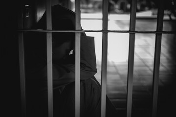 Hands of women desperate to catch the iron prison,prisoner concept,thailand people,Hope to be...