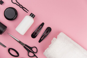 Professional hair dresser tools with copy space. Hair stylist equipment set on pink background....