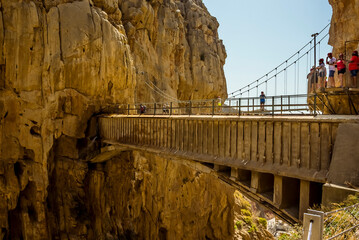 A view from the Caminito del Rey pathway of footbridges spanning the Gaitanejo river gorge near Ardales, Spain in summertime