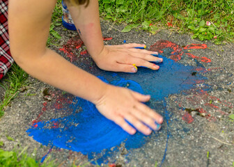 photography with a child's hands and bright colors, drawings on stone slabs, summer occupation, summer