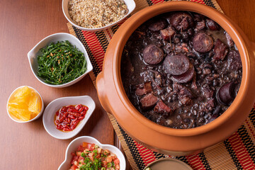 Typical Brazilian dish called Feijoada. Made with black beans, pork and sausage.