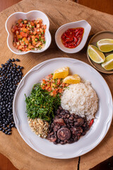 Typical Brazilian dish called Feijoada. Made with black beans, pork and sausage.