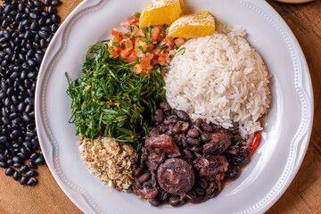 Typical Brazilian dish called Feijoada. Made with black beans, pork and sausage.