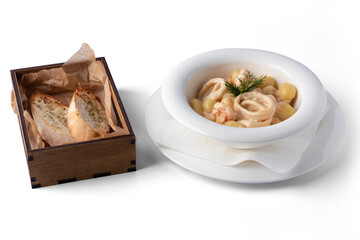 Potato gnocchi with seafood, on a white plate, for delivery, Mediterranean food