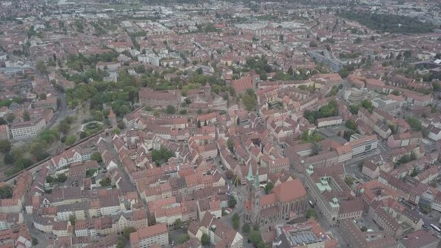 NUREMBERG, GERMANY September 01 2018: Aerial view of Nuremberg old city on Pegnitz river. Medieval church Sankt Sebald ancient architecture, half-timbered buildings, red roofs.