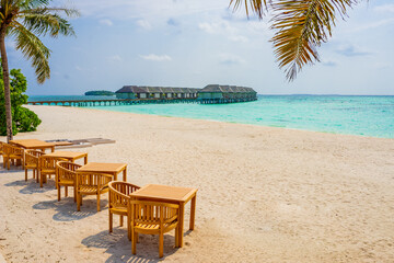 Maldives Resort Beach with Chairs and Tables