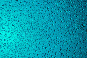 Close-up of water drops on glass . Abstract background texture.