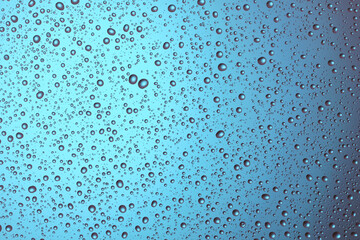 Close-up of water drops on glass . Abstract background texture.