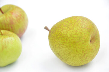 the green ripe pear with apple isolated on white background.