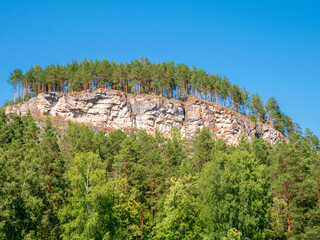 Obraz premium Landscape, mountain and forest in summer day against a blue sky.