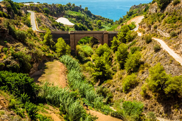Fototapeta na wymiar A view down the ravine of Cazadores near Nerja, Spain in the summertime