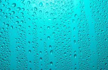 Close-up of water drops on glass . Abstract background texture.