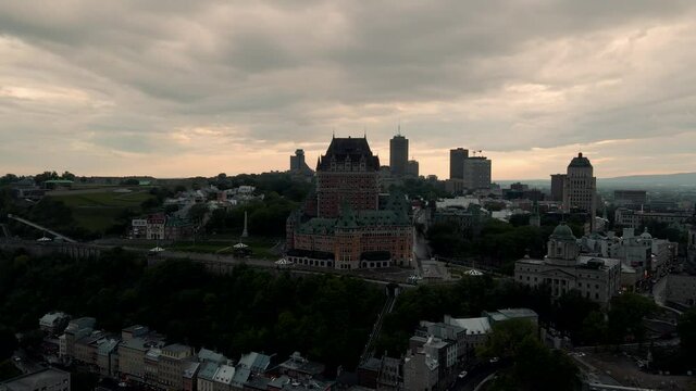 Historic Hotel Of Fairmont Le Chateau Frontenac Beside The Wolfe&ndash;Montcalm Monument In Quebec City, Canada On  A Cloudy Day. - aerial drone