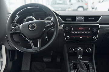 Obraz premium Front panel of brand new modern vehicle with digital tablet and control panel