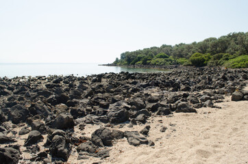 Rocks of volcanic origin on the beach of the island of Lihada-Greece 