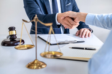 Businesswoman Shaking hands with lawyer after good deal of contract