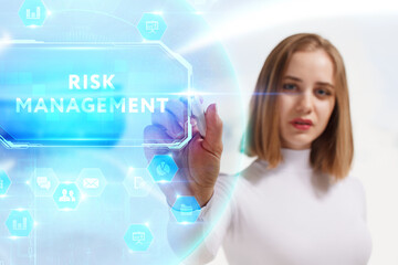 Business, Technology, Internet and network concept. Young businessman working on a virtual screen of the future and sees the inscription: Risk management