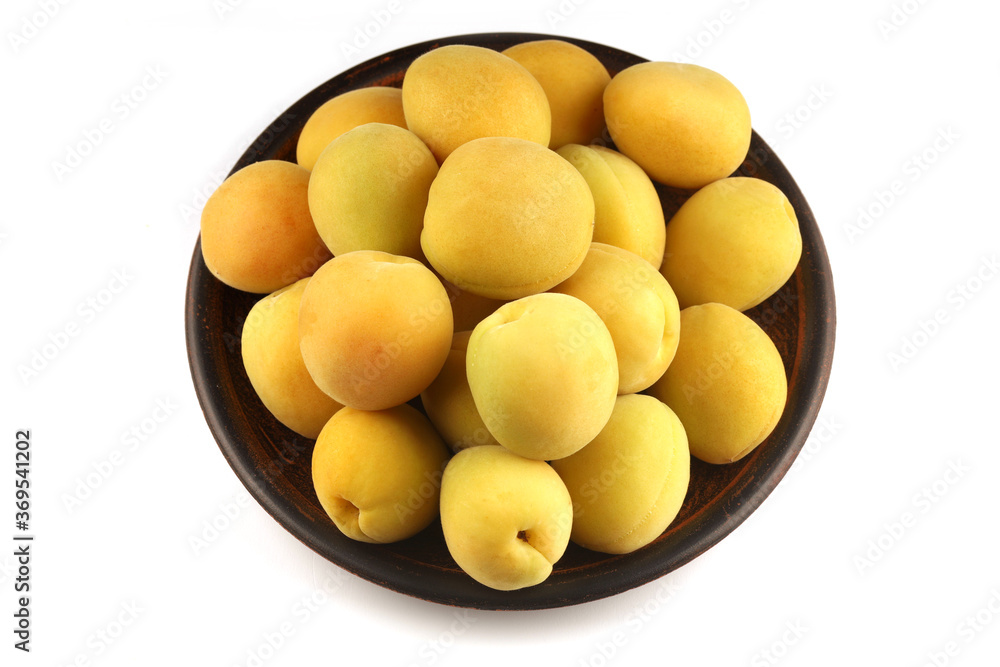 Wall mural Apricot in a plate white background