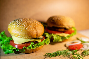 Fresh tasty burgers. Two large burgers with pork, cheese and tomatoes